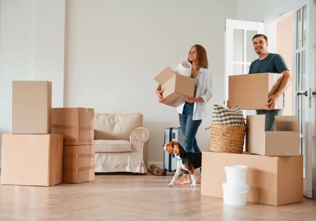 photo-of-man-and-woman-moving-boxes