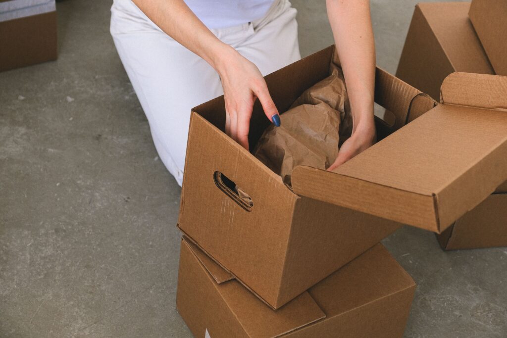 A woman unpacking a box