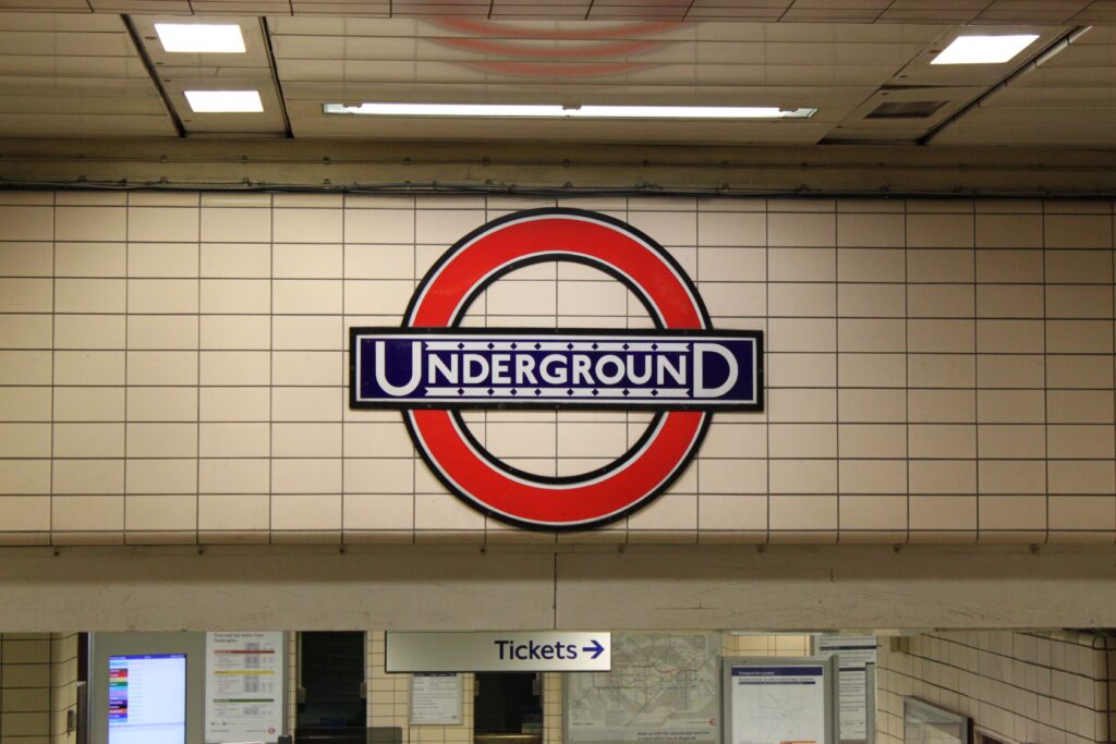 Close-up of the classic London Underground sign at a subway station entrance